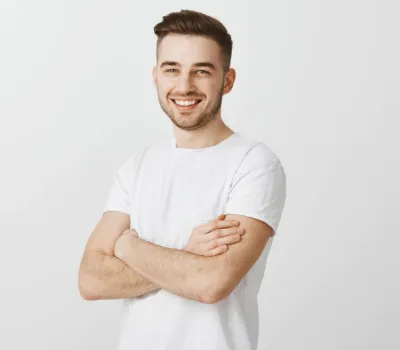 man in white t-shirt, hands crossed