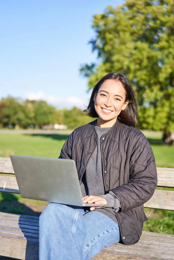 young asian woman working remotely